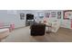 Finished basement with TV, couches, and sports decor at 8834 Pin Oak Dr, Zionsville, IN 46077