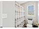 Cozy bathroom featuring a tub shower with gray and white curtains at 8834 Pin Oak Dr, Zionsville, IN 46077