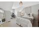 Cozy bedroom with desk, chair, and ample natural light at 8834 Pin Oak Dr, Zionsville, IN 46077