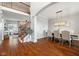 Spacious foyer showcasing hardwood floors, a staircase, and an open dining area at 8834 Pin Oak Dr, Zionsville, IN 46077