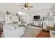 Bright living room featuring hardwood floors, modern decor, and comfortable seating arrangement at 8834 Pin Oak Dr, Zionsville, IN 46077