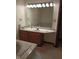 Bathroom featuring a marble vanity and a separate tub with marble surround at 8955 Stonegate Rd # A, Indianapolis, IN 46227