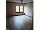 Bedroom featuring a large window with window seat and a neutral color palette at 8955 Stonegate Rd # A, Indianapolis, IN 46227