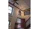 Bright foyer featuring dark wood trim and a striking light fixture at 8955 Stonegate Rd # A, Indianapolis, IN 46227