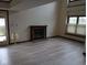 Bright living room featuring a brick fireplace, large windows, and neutral color palette at 8955 Stonegate Rd # A, Indianapolis, IN 46227