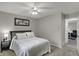 Comfortable bedroom with ceiling fan, large window and neutral tones, creating a relaxing atmosphere at 9242 Golden Leaf Way, Indianapolis, IN 46260