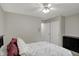Bedroom featuring a double closet and neutral tones, creating a serene and organized space at 9242 Golden Leaf Way, Indianapolis, IN 46260