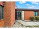 Close up of the front entrance featuring brick facade and clear view through the glass door at 9242 Golden Leaf Way, Indianapolis, IN 46260