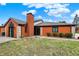Charming single-story brick home with a well-manicured lawn and inviting entryway at 9242 Golden Leaf Way, Indianapolis, IN 46260