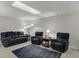 Comfortable living room with a plush sofa, recliners, and a decorative blue rug at 9242 Golden Leaf Way, Indianapolis, IN 46260