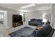 Comfortable living room with plush seating, a large TV, and a cozy atmosphere at 9242 Golden Leaf Way, Indianapolis, IN 46260