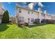 Well-maintained backyard, featuring a lush lawn and back exterior of the house at 1045 Evening Shade Cir, Beech Grove, IN 46107