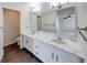 Bathroom showcasing double sinks, marble countertops, and updated fixtures at 1045 Evening Shade Cir, Beech Grove, IN 46107