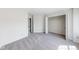 Bedroom with neutral carpet, large closet, and access to bathroom at 1045 Evening Shade Cir, Beech Grove, IN 46107