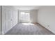 Bright bedroom featuring soft carpet, ample natural light, and a spacious closet at 1045 Evening Shade Cir, Beech Grove, IN 46107