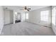 Bright bedroom with two windows, a ceiling fan, and neutral-toned carpet at 1045 Evening Shade Cir, Beech Grove, IN 46107