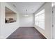Dining room with hardwood flooring, a modern chandelier, and a pass through to the kitchen at 1045 Evening Shade Cir, Beech Grove, IN 46107