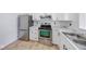 Modern kitchen boasting white cabinets, stainless steel appliances, and stylish countertops at 1045 Evening Shade Cir, Beech Grove, IN 46107