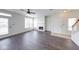 Inviting living room with fireplace, large windows for plenty of natural light, and wood floors at 1045 Evening Shade Cir, Beech Grove, IN 46107