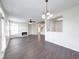 Open concept living room flowing into dining area, featuring a fireplace and abundant natural light at 1045 Evening Shade Cir, Beech Grove, IN 46107