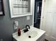 Bathroom sink and decor featuring modern faucet and vanity with white vessel sink at 109 S County Line Rd, , IN 47272