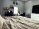 Comfortable bedroom featuring a desk, gaming chair, modern dresser and large screen TV at 109 S County Line Rd, , IN 47272