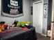 Bedroom with sports decor, a closet, and soft stuffed animals on the bed at 109 S County Line Rd, , IN 47272