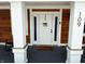 Welcoming front entrance with a white door, decorative wreath, and covered porch at 109 S County Line Rd, , IN 47272