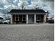 Charming single-story home with wood siding, white columns, and an inviting front porch at 109 S County Line Rd, , IN 47272