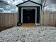 Backyard storage shed with a ramp showcases ample room for equipment and tools at 109 S County Line Rd, , IN 47272