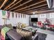 Finished basement area with living space and television at 1237 E Pleasant Run Pkwy S Dr, Indianapolis, IN 46203