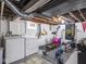 Unfinished basement with laundry and exercise area at 1237 E Pleasant Run Pkwy S Dr, Indianapolis, IN 46203