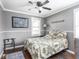 Bedroom with ceiling fan, natural light, and rustic decor at 1237 E Pleasant Run Pkwy S Dr, Indianapolis, IN 46203
