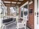 Inviting front porch with a comfortable seating area to enjoy the outdoors at 1237 E Pleasant Run Pkwy S Dr, Indianapolis, IN 46203