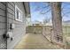 A back deck constructed with wood, featuring metal railings, and wooden supports at 1310 N Chester Ave, Indianapolis, IN 46201