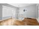 Open foyer featuring hardwood floors, decorative chandelier and bright windows at 1310 N Chester Ave, Indianapolis, IN 46201