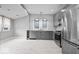 Modern kitchen featuring stainless steel appliances and gray cabinetry at 1310 N Chester Ave, Indianapolis, IN 46201