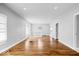 Bright living room featuring hardwood floors, abundant natural light, and an open concept design at 1310 N Chester Ave, Indianapolis, IN 46201