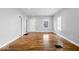 Light-filled living room with hardwood floors, crisp white trim, and a welcoming atmosphere at 1310 N Chester Ave, Indianapolis, IN 46201