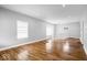 Open living area boasting hardwood floors, large windows, and smooth flow to the upper level at 1310 N Chester Ave, Indianapolis, IN 46201