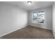 Bedroom featuring plush carpet, neutral walls, and a dual window that allows natural light to enter the room at 13211 N Landing W Cir, Camby, IN 46113