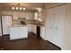 Functional kitchen with white cabinets, modern appliances, and a breakfast bar at 143 Tracy Ridge Blvd, Whiteland, IN 46184