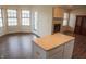 Open living space combining a dining area and living room with hardwood floors and a fireplace at 143 Tracy Ridge Blvd, Whiteland, IN 46184