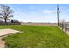 Large backyard space with grassy lawn and distant barn, perfect for recreation at 153 Terrace Ct, Franklin, IN 46131