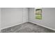 Bedroom featuring grey walls, neutral carpet, and a door to the outside at 153 Terrace Ct, Franklin, IN 46131
