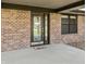 Up close view of the home's brick facade and attractive glass front door at 153 Terrace Ct, Franklin, IN 46131