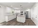 Modern kitchen with an island, white cabinets, granite counters and stainless appliances at 153 Terrace Ct, Franklin, IN 46131