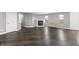 Bright, open living room features wood flooring, a fireplace and natural light at 153 Terrace Ct, Franklin, IN 46131