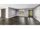 Stylish living room with dark floors, a barn door and modern gray walls at 153 Terrace Ct, Franklin, IN 46131