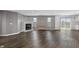 Spacious living room with dark wood floors, a fireplace, and large windows at 153 Terrace Ct, Franklin, IN 46131